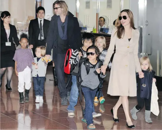  ?? Toru Yamanaka/afp/getty Images ?? Brad Pitt and Angelina Jolie admit six children are a handful, but there are plenty of advantages to multiple siblings — from built-in playmates to lessons in sharing.