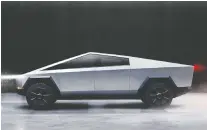  ?? TESLA ?? The new Tesla Cybertruck seems to come back from the future.