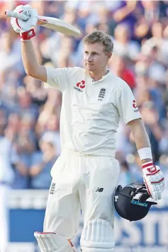  ?? — AFP photo ?? England's captain Joe Root celebrates after reaching his century during play on the opening day of the first Test cricket match between England and the West Indies at Edgbaston in Birmingham, central England on August 17, 2017.