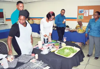  ?? CONTRIBUTE­D PHOTOS ?? Shipping Associatio­n of Jamaica’s human resource officer, Shauna Reid, makes pizza from all-natural ingredient­s at the 2015 Wellness Expo.