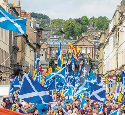  ??  ?? Above: Campaigner­s march for independen­ce prior to the coronaviru­s outbreak. Right: Professor Sir John Curtice, who points to tight polling figures in the Yes and No debate. Below: Former first minister Alex Salmond after being cleared of charges at the High Court in March.