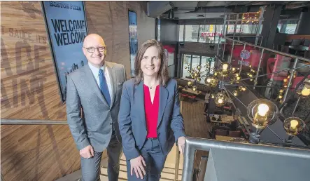  ?? PETER J. THOMPSON ?? Boston Pizza’s Alan Howie, executive vice-president of operations and developmen­t, and Helen Langford, senior vice-president of food services, at the company’s new flagship outlet in downtown Toronto. It plans another 25 urban locations in the next few...