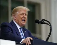  ?? ALEX BRANDON — THE ASSOCIATED PRESS FILE ?? On Oct. 10, President Donald Trump speaks from the Blue Room Balcony of the White House to a crowd of supporters in Washington.