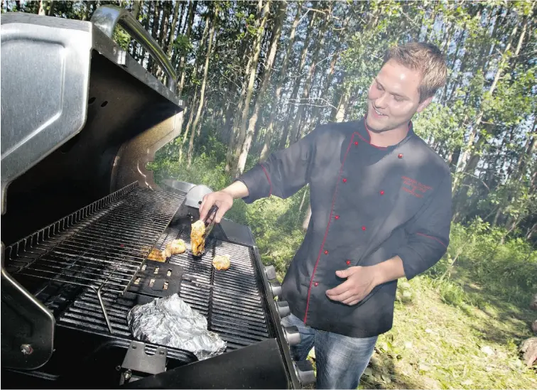  ?? Photos: JASON FRANSON/ EDMONTO N JOURNAL ?? Chef Sheridan McLaren prepares an outdoor barbecue feast at his family’s acreage near Cooking Lake.