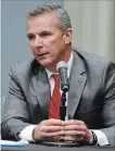  ?? PAUL VERNON THE ASSOCIATED PRESS ?? Ohio State football coachUrban Meyer answers questions during a news conference in Columbus, Ohio, on Wednesday.