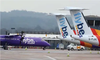  ?? Photograph: Geoff Caddick/AFP via Getty Images ?? Grounded: Flybe aircraft on the tarmac at Exeter airport on Thursday after the news that the airline had collapsed into bankruptcy.