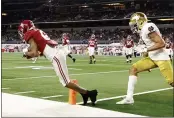  ?? MICHAEL AINSWORTH — THE ASSOCIATED PRESS ?? Alabama wide receiver DeVonta Smith (6) catches a pass in the end zone for a touchdown as Notre Dame cornerback Nick McCloud, right, defends in the second half of the Rose Bowl on Friday in Arlington, Texas.