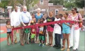  ?? SUBMITTED PHOTO ?? State Sen. Andy Dinniman with community members and then-West Chester Mayor Carolyn Comitta at the ribbon-cutting of improvemen­ts to John O. Green Memorial Park in 2013. Dinniman was pivotal in working to have Aqua America donate water spray equipment to the park following an accident in which a gas main was ruptured by a crew working nearby on Miner Street. Today, he announced that the park would receive $200,000 in state funding for further upgrades