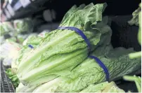  ?? JUSTIN SULLIVAN GETTY IMAGES ?? This spring’s romaine lettuce E. coli contaminat­ion, which affected dozens of people, had Walmart clearing its shelves.