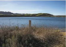  ?? Stephen Lam / The Chronicle ?? A depth gauge stands partially exposed at Briones Reservoir in Orinda late last month as drought looms on the horizon.