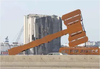  ?? Reuters ?? A view shows the justice symbol monument placed near the grain silo damaged during the 2020 port blast, in Beirut, Lebanon, on Tuesday. —