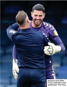  ??  ?? Newport boss Mike Flynn celebrates with goalkeeper Tom King