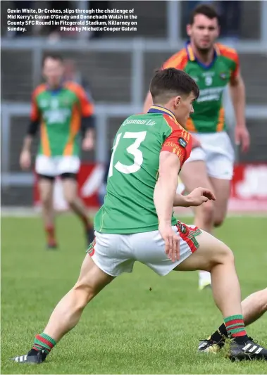  ?? Photo by Michelle Cooper Galvin ?? Gavin White, Dr Crokes, slips through the challenge of Mid Kerry’s Gavan O’Grady and Donnchadh Walsh in the County SFC Round 1 in Fitzgerald Stadium, Killarney on Sunday.