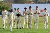  ?? GETTY IMAGES ?? The Black Caps clap off team-mate Ajaz Patel, second from left, after he took a five-wicket haul against Sri Lanka in Galle.