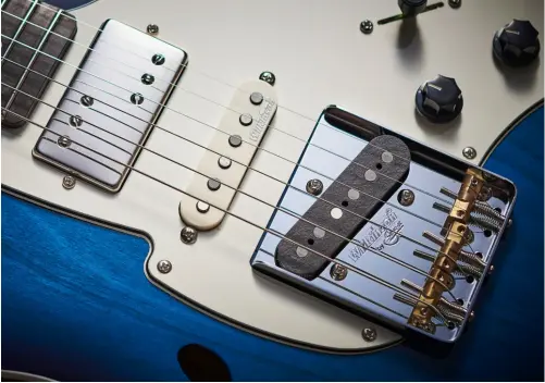  ??  ?? The Fret-King crams in the value with a WVC 3+3 humbucker at the neck, an over-wound WHS single coil in the middle position, and a tapped WVOBT single coil at the bridge – all by Wilkinson