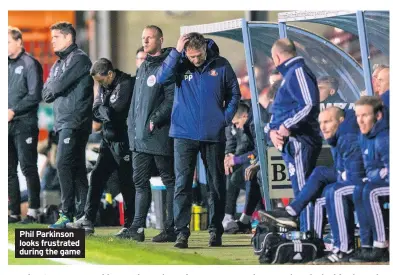  ??  ?? Phil Parkinson looks frustrated during the game