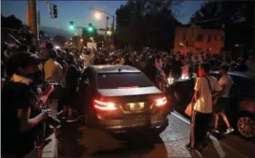  ??  ?? Protesters surround a car as they march in the street response to a not guilty verdict in the trial of former St. Louis police officer Jason Stockley Saturday, Sept. 16, 2017, in St. Louis. Stockley was acquitted in the 2011killin­g of a black man...