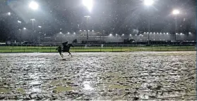  ??  ?? Grounds for concern: Churchill Downs shows the effects of a 24-hour deluge