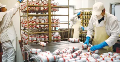  ?? (Dado Ruvic/Reuters) ?? HALAL-CERTIFIED salamis are seen at an Akova Impex Meat Industry Ovako factory in Sarajevo earlier this month. Bosnia has become a regional hub for halal products since it set up Europe’s first agency for halal-quality certificat­ion in 2006.