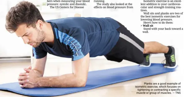  ?? — TNS ?? Planks are a good example of isometric exercise, which focuses on tightening or contractin­g a specific muscle or group of muscles.