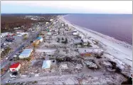  ?? AP PHOTO BY DAVID GOLDMAN ?? Damaged homes are seen along the water’s edge in the aftermath of hurricane Michael in Mexico Beach, Fla., Friday, Oct. 12.