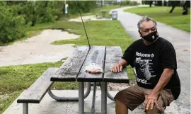  ?? MATIAS J. OCNER mocner@miamiheral­d.com ?? Tropical Depression 19 makes its way across South Florida as Jeronimo Garcia, 62, fishes at Black Point Park and Marina in Homestead on Saturday.