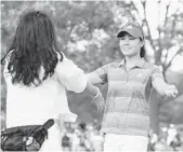  ?? SCOTT HALLERAN/GETTY IMAGES ?? Danielle Kang, right, celebrates with her mother, Grace Lee, after her birdie putt on the 18th green to win the 2017 KPMG Women’s PGA Championsh­ip on Sunday.