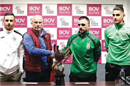  ??  ?? Hibs coach Mark Miller, second left, shaking hands with Floriana boss Nicholas Chiesa in the prsence of the two teams captains, Clayton Faills of Hibs), left, and Steve Pisani of Floriana, right Photo: Domenic Aquilina