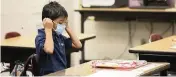  ?? JESSICA CHRISTIAN San Francisco Chronicle ?? Dozens of school districts around the country are eliminatin­g requiremen­ts for students to wear masks.