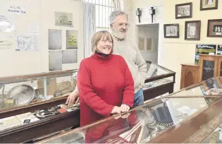  ??  ?? Passion for history . . . Waikouaiti Coast Heritage Centre curator Kay and chairman Bill Lang among the displays at the museum.