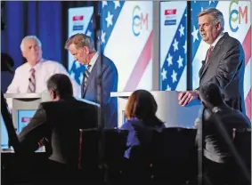  ?? SEAN D. ELLIOT/THE DAY ?? Republican candidate Bob Stefanowsk­i, right, answers a question as he, Democrat Ned Lamont, center, and petitionin­g candidate Oz Griebel, left, face off in their final gubernator­ial debate at the Premier Ballroom at Foxwoods Resort Casino on Tuesday.