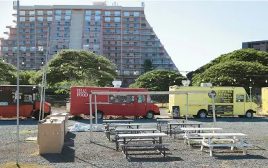  ?? MARCO GARCIA/AP ?? Food trucks that mostly cater to tourists at Maui’s hotels remain closed Sept. 1 in Kahana, Hawaii, weeks after wildfires.