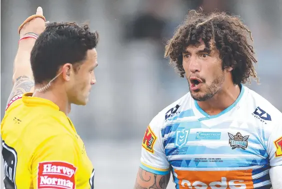  ??  ?? An incredulou­s Titans skipper Kevin Proctor reacts to his dismissal by referee Henry Perenara for allegedly biting Shaun Johnson (below).
Main picture: PHIL HILLYARD