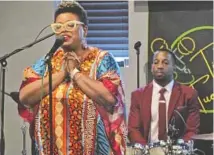  ?? ?? Vocalist Meagan McNeil and drummer Greg Artry perform for an enthusiast­ic crowd at a recent jazz night in western Cook County.