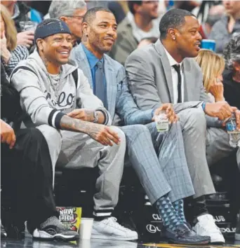  ?? David Zalubowski, The Associated Press ?? From left, former Nuggets stars Allen Iverson, Kenyon Martin and Marcus Camby watch their old team defeat the San Antonio Spurs in Denver on Friday night.