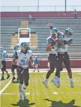  ??  ?? Capital senior Estevan Segura celebrates after he intercepte­d a pass late in the fourth quarter.