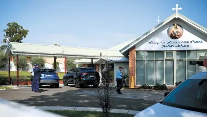  ?? EPA-Yonhap ?? Police investigat­e in front of the Good Shepherd Church in the suburb of Wakeley, Sydney, Tuesday.