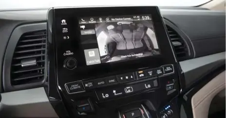  ?? COURTESY OF HONDA CANADA ?? Honda’s Cabin Talk and Watch system, available in the Odyssey minivan, uses a ceiling-mounted camera to let drivers keep tabs on rear-seat passengers.
