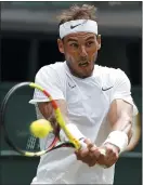  ?? PHOTOS: ALASTAIR GRANT — THE ASSOCIATED PRESS ?? Tennis greats Roger Federer, left, and Rafael Nadal will meet for the 40th time Friday with a berth in the Wimbledon final on the line.