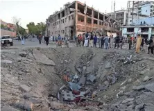  ?? WAKIL KOHSAR, AFP/GETTY IMAGES ?? Wednesday’s tanker truck explosion was so powerful it left a crater in the concrete and gutted an entire city block.