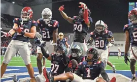  ?? JEROME MIRON/USA TODAY ?? Former Texas cornerback Ryan Watts, second from left, celebrates with his West squad teammates after Jarius Monroe of Tulane intercepte­d a pass in the East-West Shrine Bowl at the Star in Frisco. Watts had three solo tackles in the game while playing both cornerback and safety.