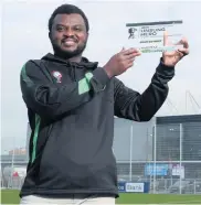  ??  ?? Great work: Adekanmi Abayomi shows off the BBC’S 2020 Unsung Hero Award for Northern Ireland