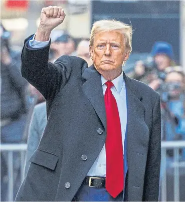  ?? ?? Donald Trump pumps his fist to his supporters in New York City in March.