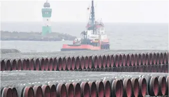  ?? AP FILE ?? Pipes for the Nord Stream 2 Baltic Sea gas pipeline are stored at the port of Mukran near Sassnitz, Germany. Russia’s natural gas pipeline to Europe faces a rocky road ahead. The U.S. has said that gas won’t flow if Russia launches military aggression against Ukraine.