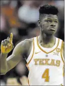  ?? Eric Gay The Associated Press ?? Texas forward Mohamed Bamba gestures Feb. 7 during a game against Kansas
State in Austin, Texas. He ranked second nationally with 3.7 blocks per game.