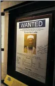  ?? TNS/Getty Images/SPENCER PLATT ?? A poster and picture used to identify Osama bin Laden is displayed at the new exhibition “Revealed: The Hunt for bin Laden” at the 9/11 Memorial Museum in New York.