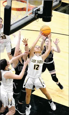  ?? MARK HUMPHREY ENTERPRISE-LEADER ?? Prairie Grove junior Torie Price rips down a defensive rebound during a 59-50 rivalry win over Lincoln in nonconfere­nce girls basketball action Dec. 8.