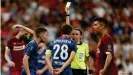  ??  ?? Frappart issues a yellow card during the men's European Supercup between Liverpool and Chelsea in 2019.