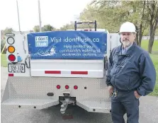  ??  ?? The Ontario Clean Water Agency’s Robert Budway stands by a truck promoting the I Don’t Flush program in LaSalle.