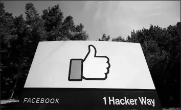  ?? JEFF CHIU / AP FILE (2020) ?? The thumbs up “Like” logo is shown on a sign April 14, 2020, at Facebook headquarte­rs in Menlo Park, Calif. Complaints whistleblo­wer Frances Haugen filed with the SEC, along with redacted internal documents obtained by media outlets, show a troubled, internally conf licted company, where data on the harms it causes is abundant, but solutions are halting at best.
